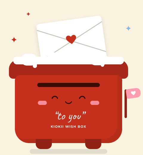 Une boîte de vœux rouge avec une lettre et un cœur
