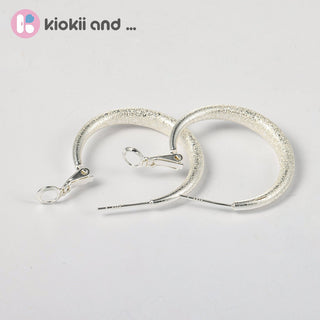 Arch14 Glittering Crescent Frosted Platinum Hoop Earrings by Arch14 – Earrings photo