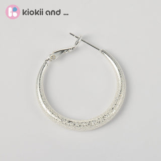 Arch14 Glittering Crescent Frosted Platinum Hoop Earrings by Arch14 – Earrings photo
