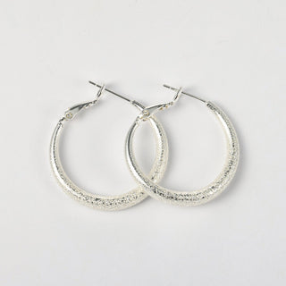 Arch14 Glittering Crescent Frosted Platinum Hoop Earrings by Arch14 – Earrings photo
