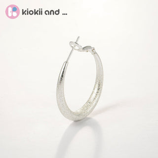 Arch14 Glittering Crescent Frosted Platinum Hoop Earrings by Arch14 – Earrings photo