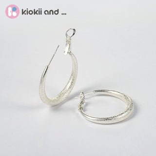 Arch14 Glittering Crescent Frosted Platinum Hoop Earrings by Arch14 – Earrings photo