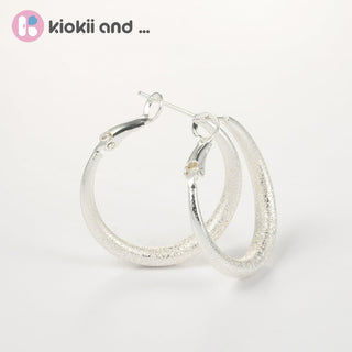 Arch14 Glittering Crescent Frosted Platinum Hoop Earrings by Arch14 – Earrings photo